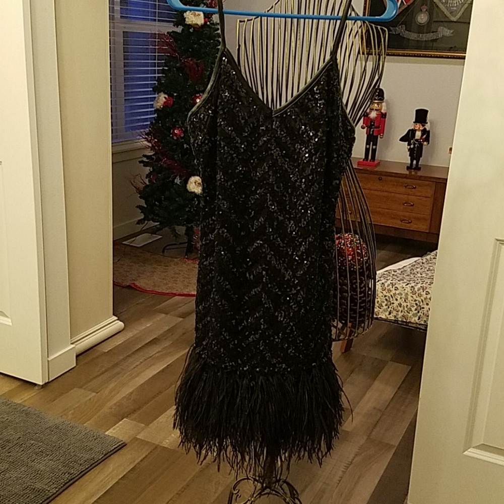 Black sequin and feather trim dress